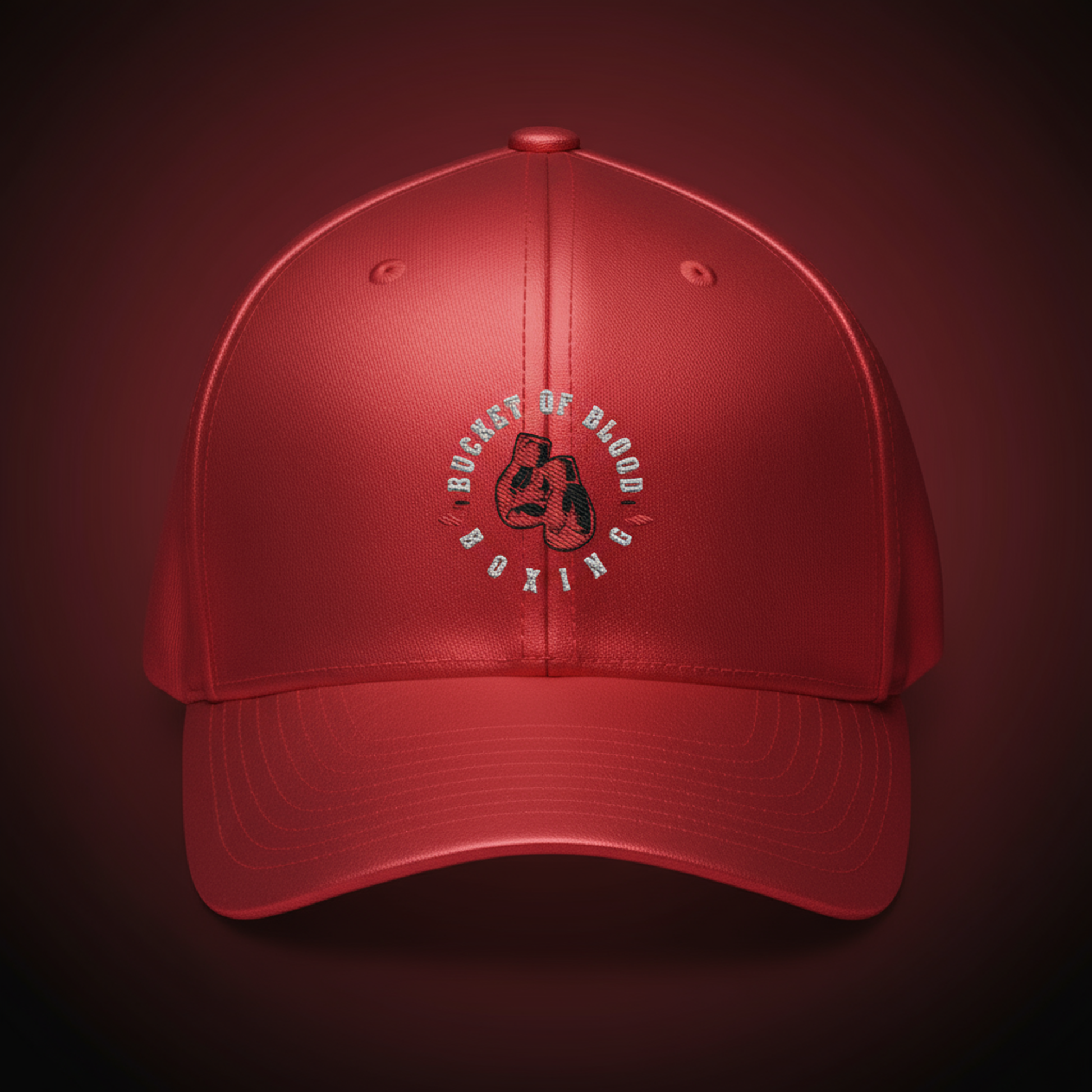 Red embroidered Bucket of Blood cap, mid-profile red baseball hat with six-panel construction, curved visor, and subtle center embroidery