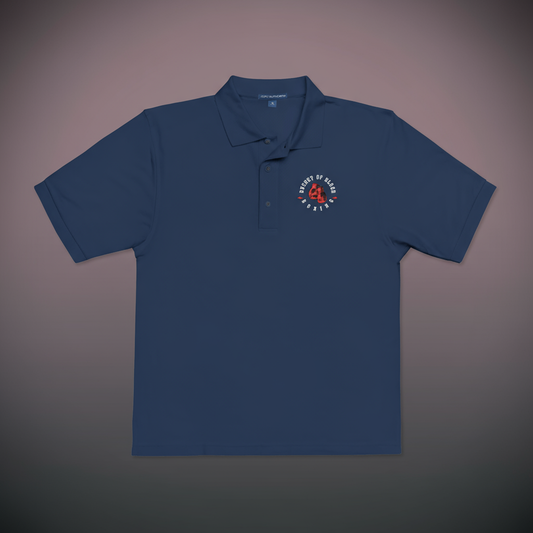 Embroidered Bucket of Blood polo shirt, soft polyester-cotton polo with stitched chest emblem, flat-knit collar, and classic casual style