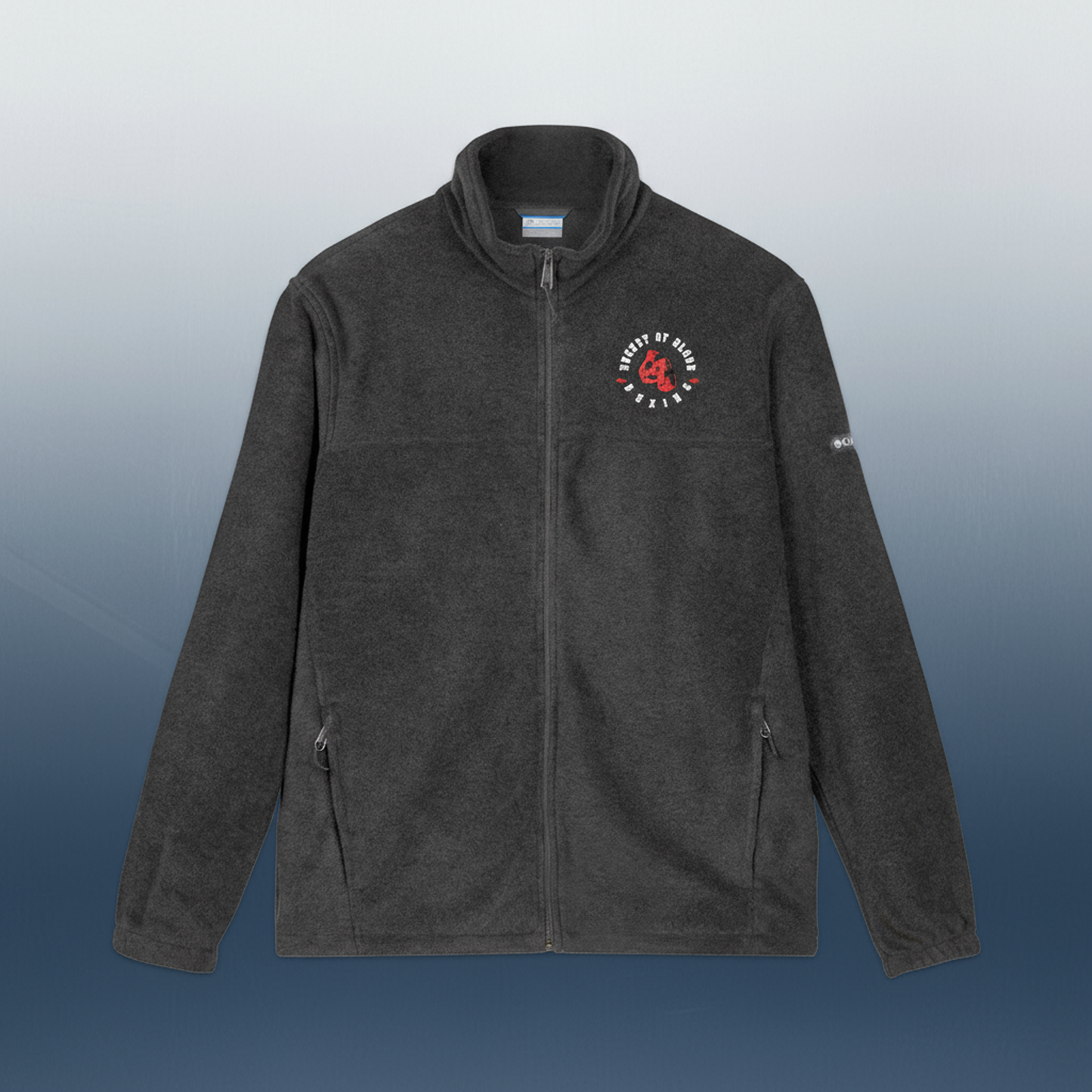 Embroidered 'Bucket of Blood' grey fleece jacket, lightweight fleece with zippered pockets, high collar, and subtle embroidered details for casual and outdoor wear