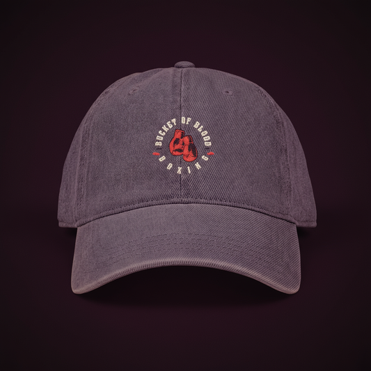 Embroidered Bucket of Blood denim hat with red rose emblem and “Queens of Chaos” lettering, vintage-style streetwear denim hat with adjustable strap