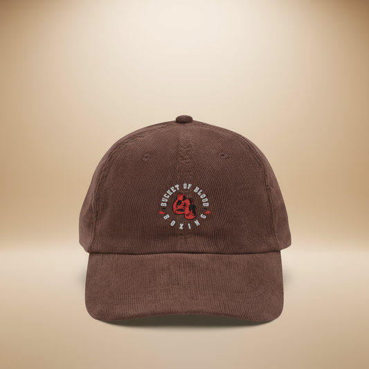 Embroidered Corduroy Bucket of Blood hat, vintage-style corduroy hat with hand-stitched emblem, low-profile unstructured crown, and adjustable strap