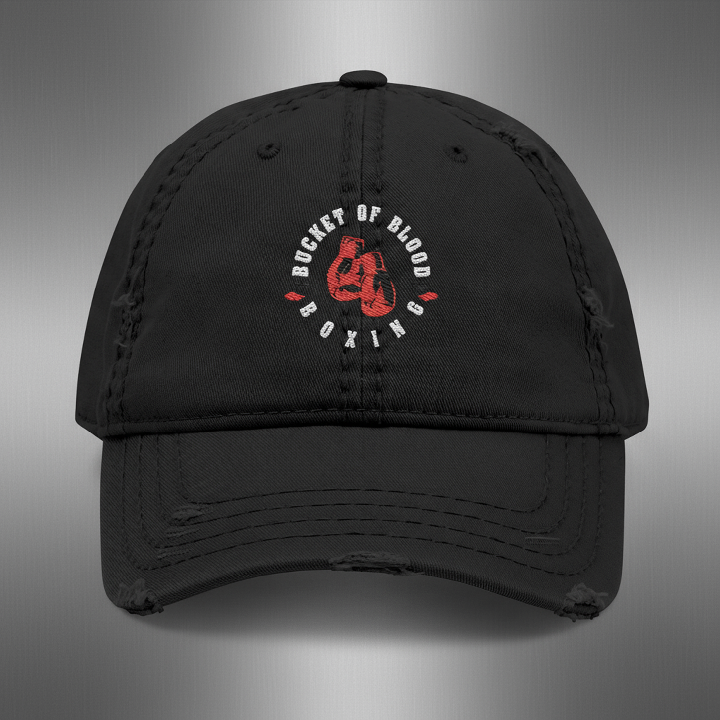 Embroidered 'Bucket of Blood' baseball cap, distressed dad hat with low-profile crown, frayed edges, and compact front embroidery