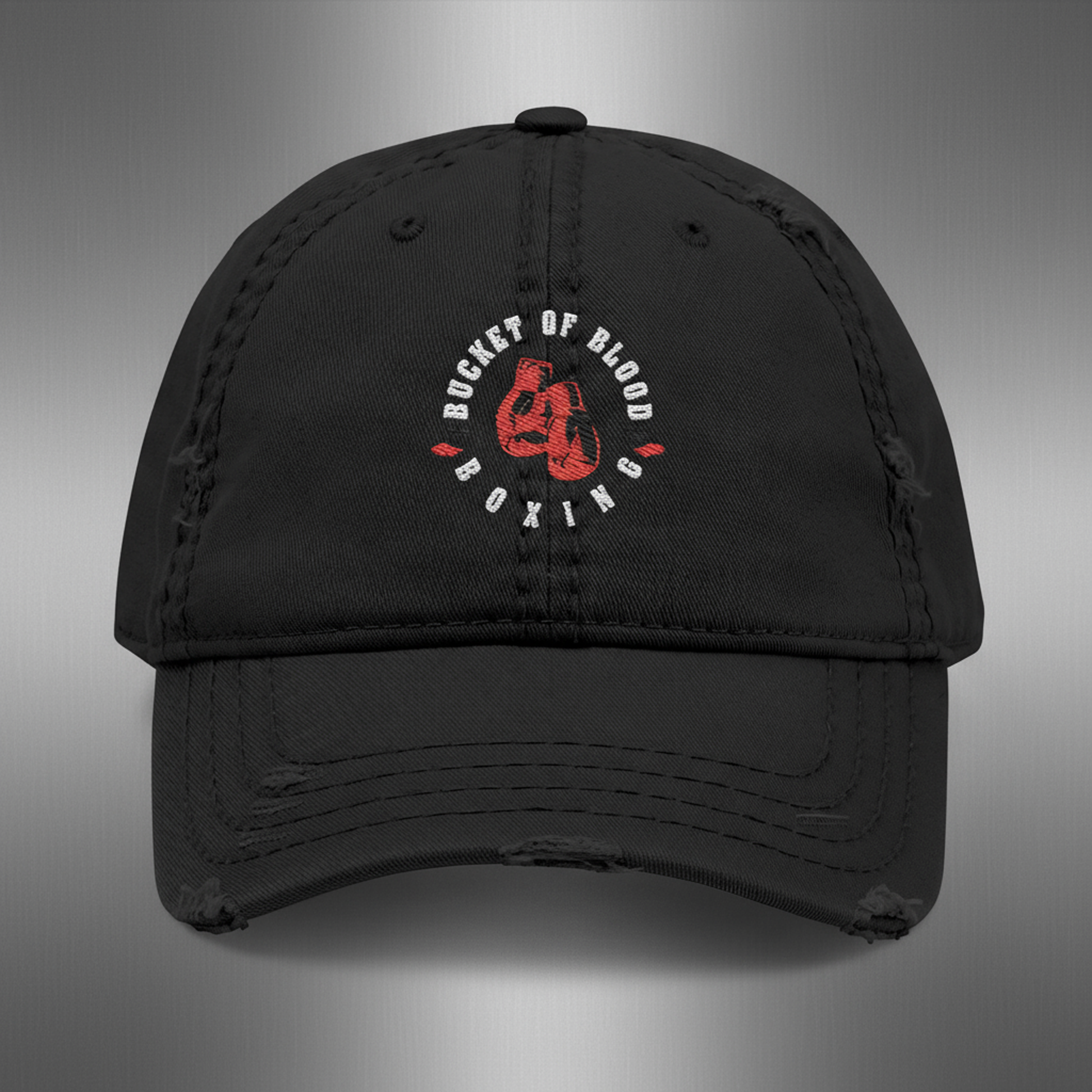 Embroidered 'Bucket of Blood' baseball cap, distressed dad hat with low-profile crown, frayed edges, and compact front embroidery
