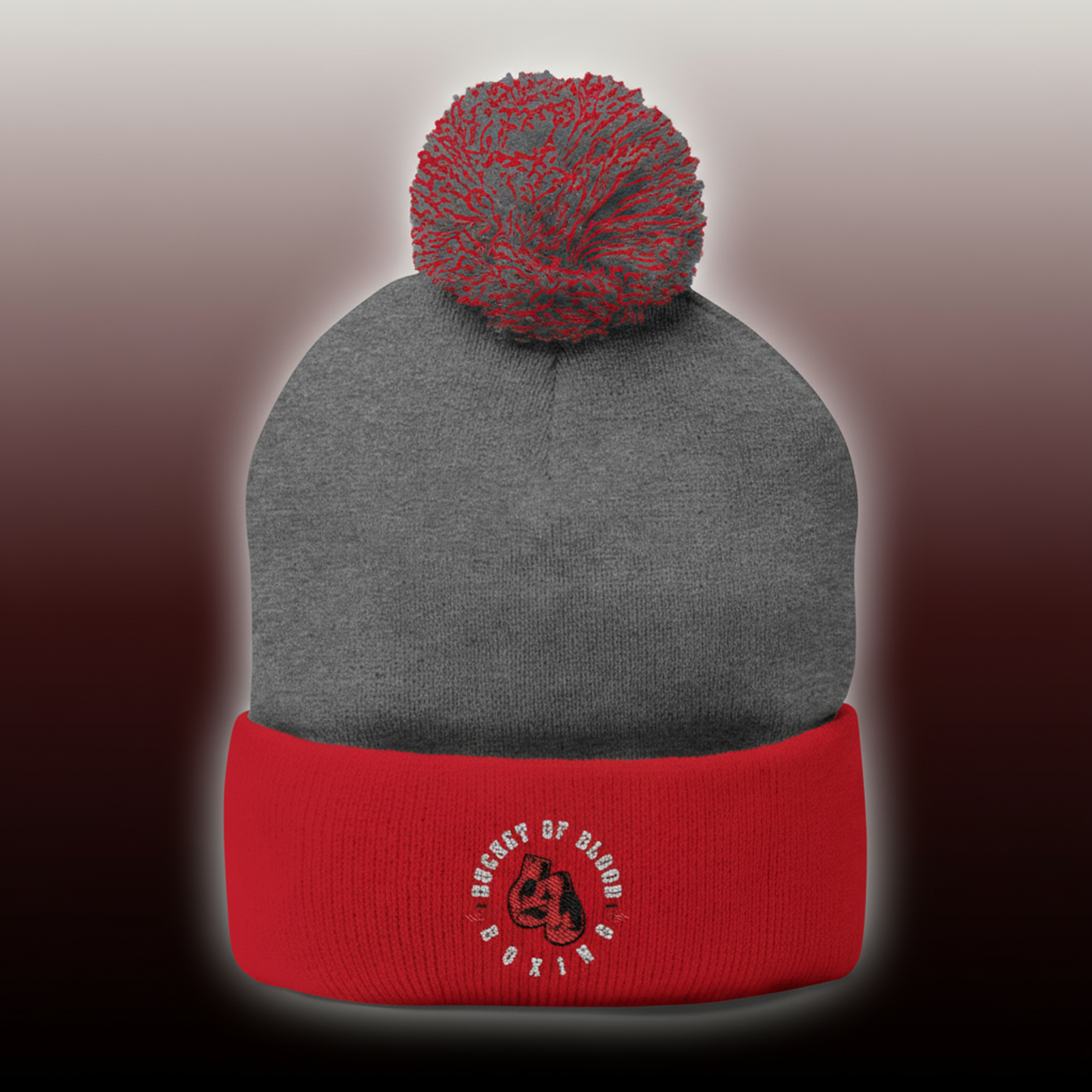 Embroidered knit cap with hand-stitched emblem and puffed pom, cozy pom-pom beanie for winter, soft and stretchy beanie